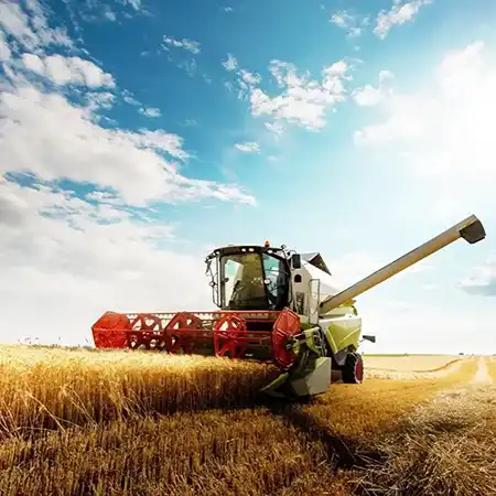 Combine harvester running harvest in a field