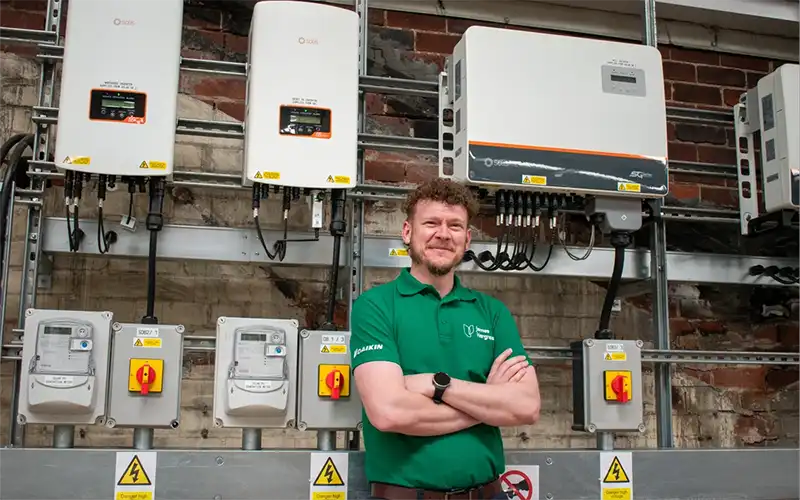 Scott Wright, employee of James Hargreaves LTD stood in front of solar power technology.