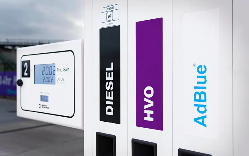 Fuel logos on a fuel pump stand.