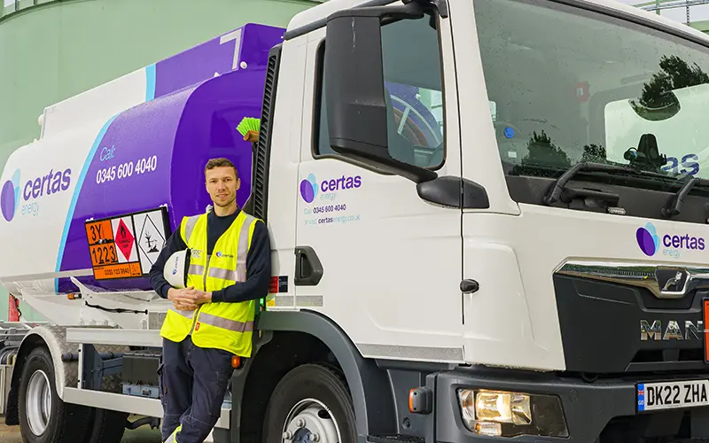 Certas Energy employee stood next to Certes Energy Oil Truck.