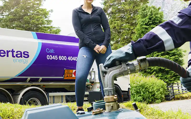 Garden heating oil tank being refilled by Certas Energy.