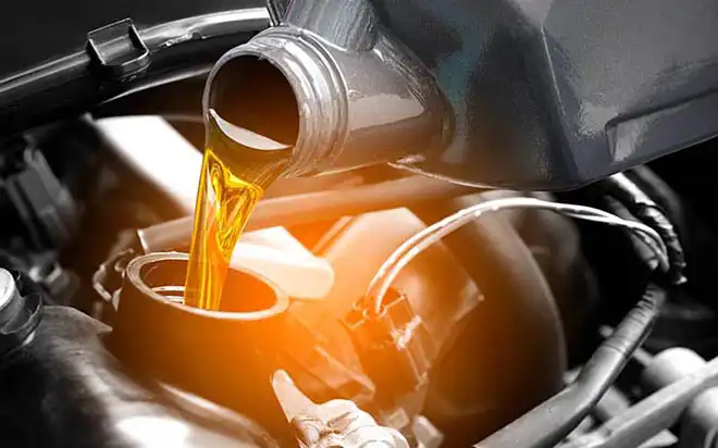 Engine oil being poured into an engine