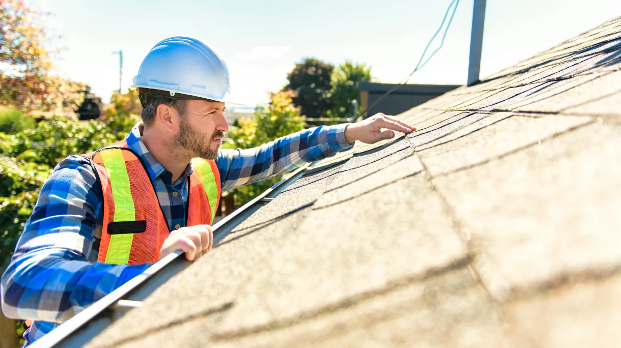 Solar technician assessing roof to provide a quote