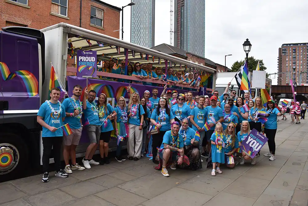 Certas Energy employees stood in group in front of Certas Energy truck at Manchester Pridee 2025.