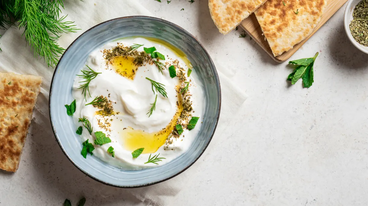 Greek yogurt dip with herbs as protein rich budget option.