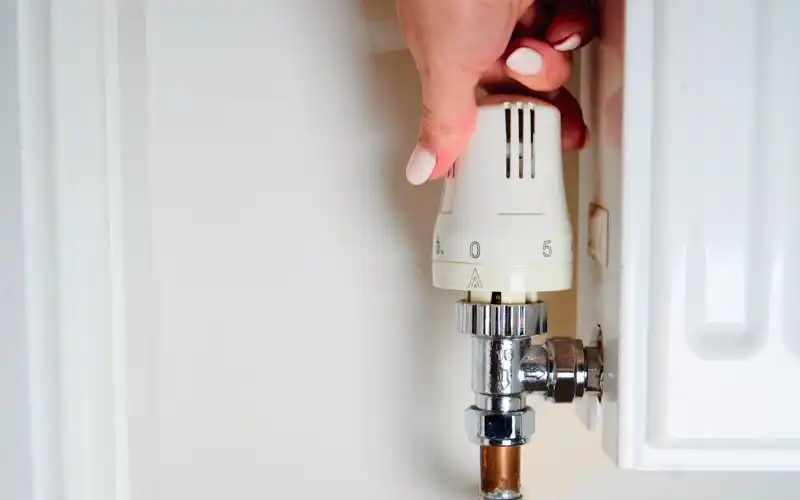 Close up of an adjustable radiator thermostat.